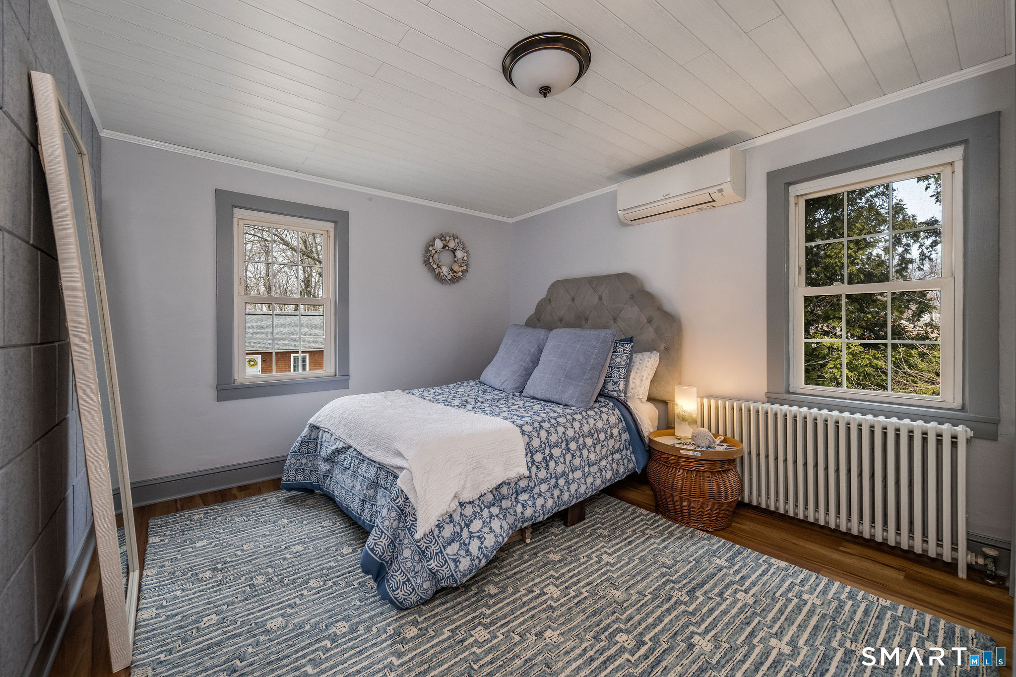 24 Cottage Place Old Saybrook, CT 06475 - Photo 23 of 38 a bedroom with a bed and a window