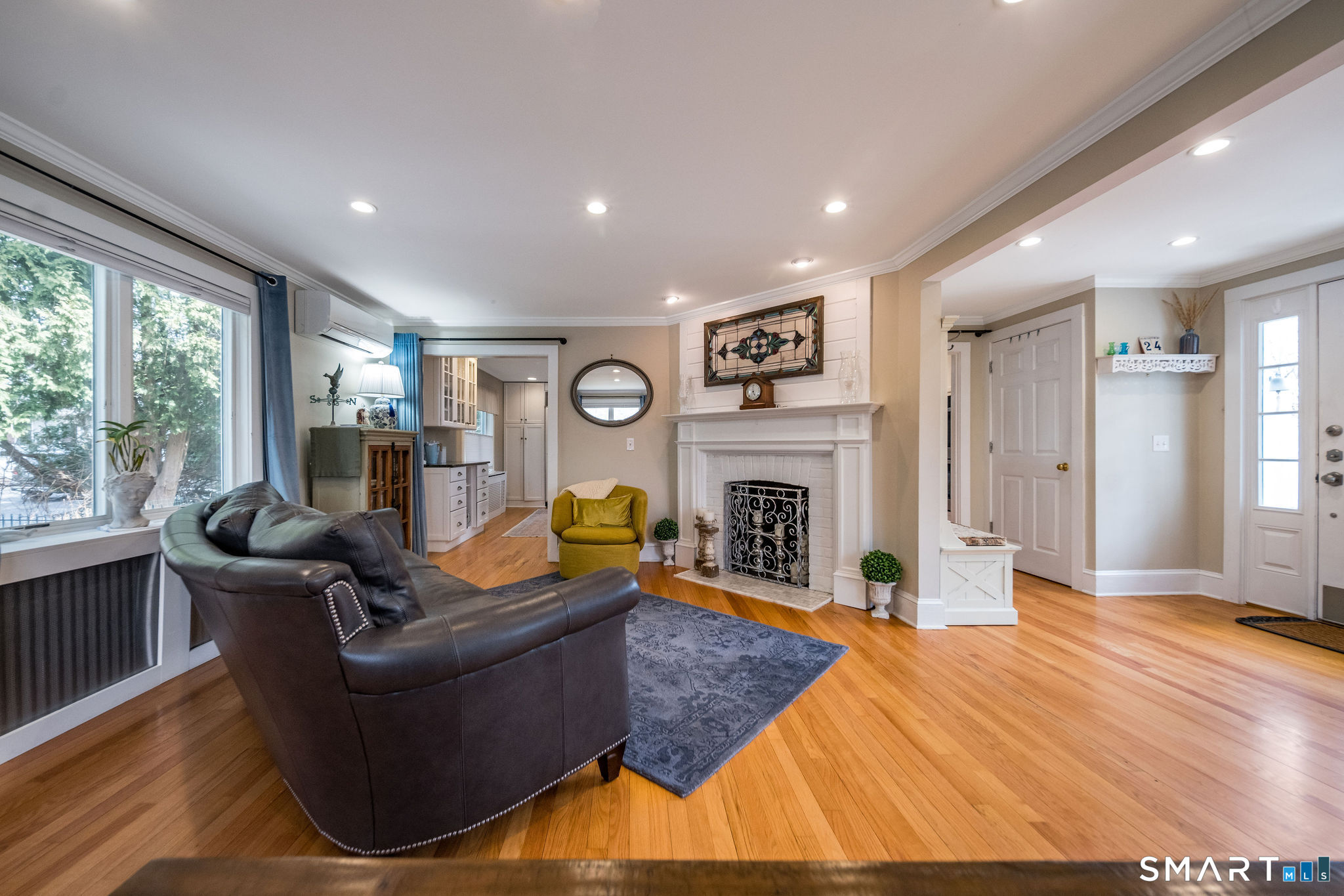 24 Cottage Place Old Saybrook, CT 06475 - Photo 6 of 38 a living room with furniture and a fireplace