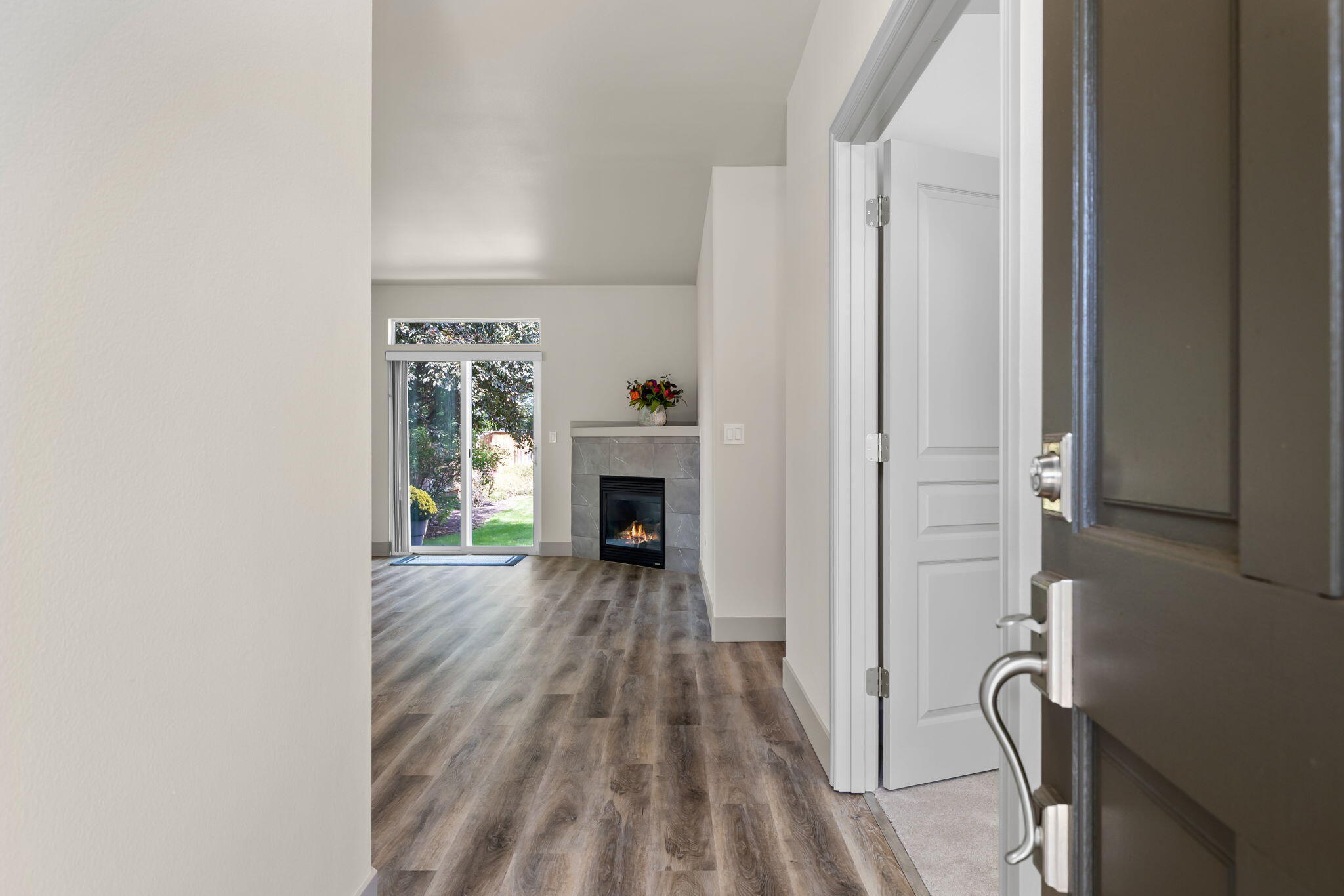 3108 Yellow Ribbon Drive Bend, OR 97701 - Photo 5 of 36 a view of a livingroom with wooden floor and a fireplace