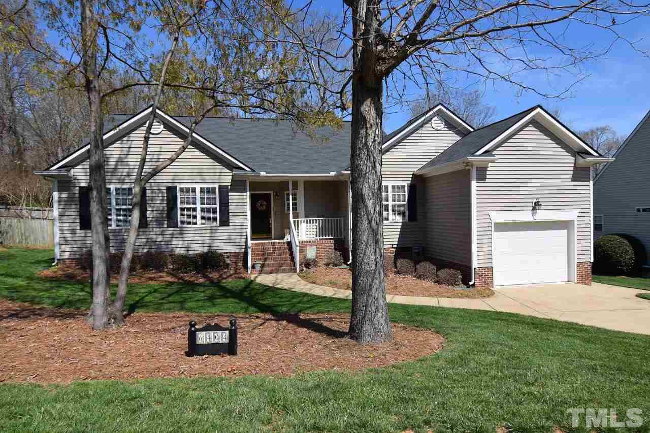 6404 Nowell Pointe Drive Raleigh, NC 27607 - Photo 1 of 24 a view of a house with backyard and a tree