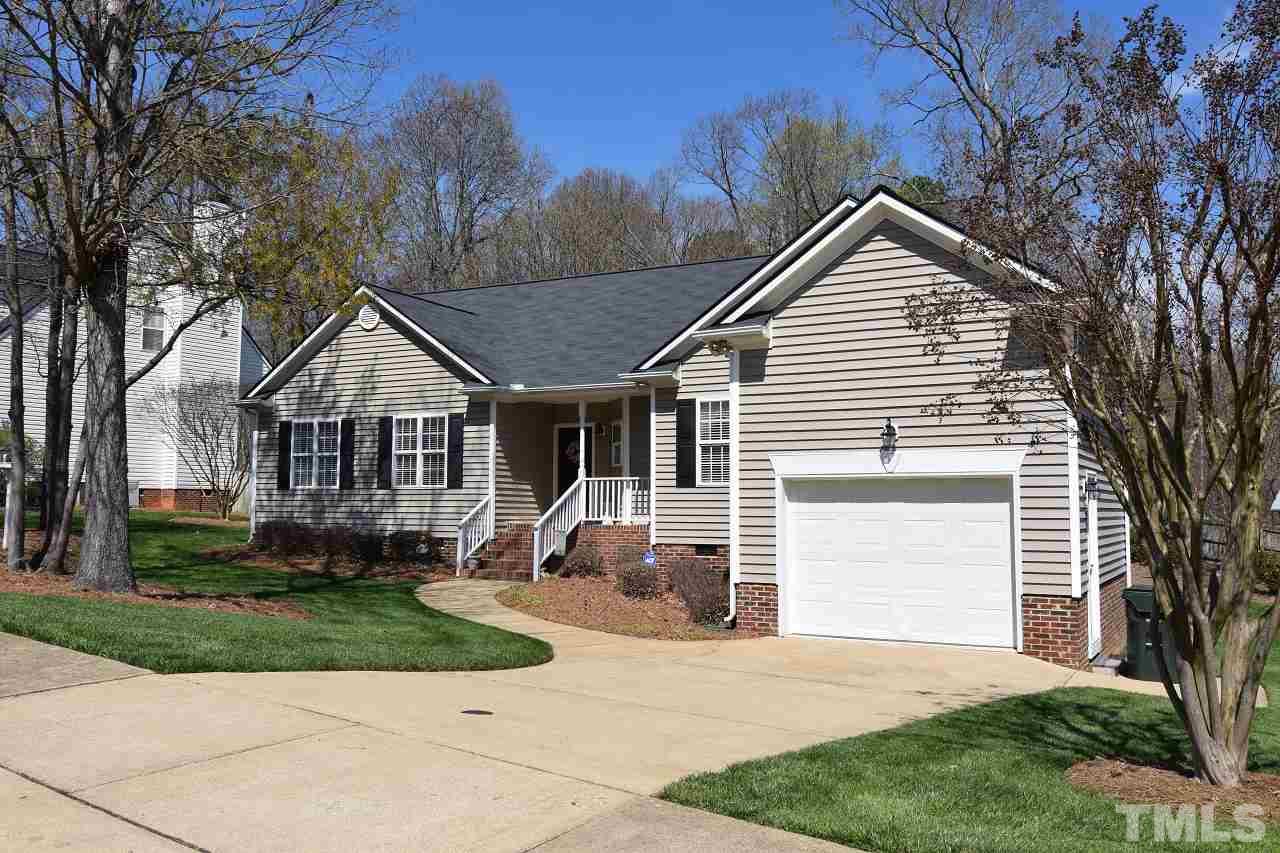 6404 Nowell Pointe Drive Raleigh, NC 27607 - Photo 2 of 24 a view of house with a yard and potted plants