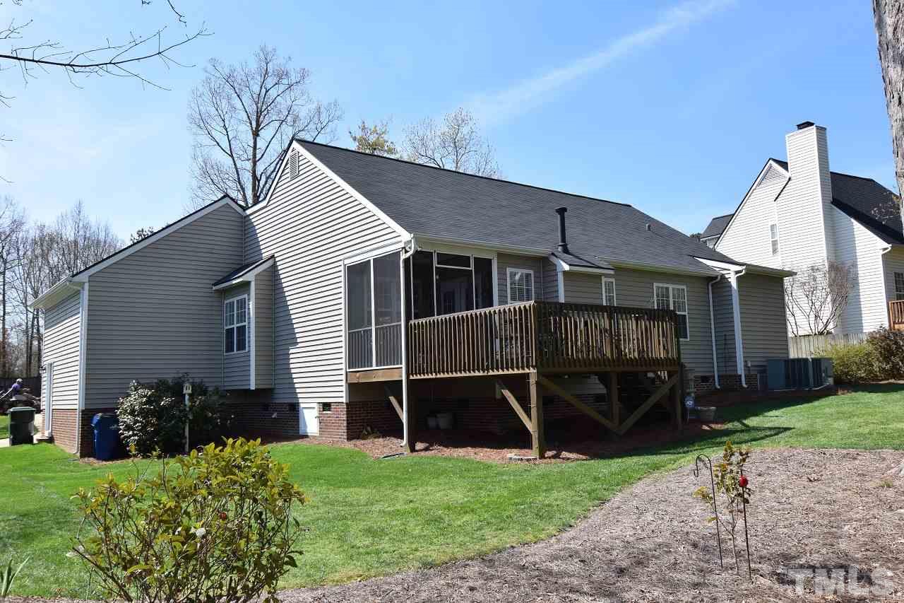 6404 Nowell Pointe Drive Raleigh, NC 27607 - Photo 21 of 24 a view of a house with a yard and plants