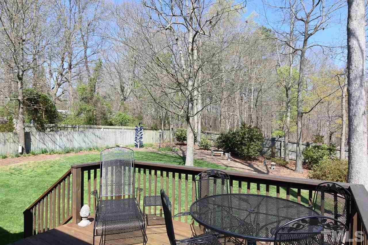 6404 Nowell Pointe Drive Raleigh, NC 27607 - Photo 22 of 24 a view of a balcony with wooden floor and fence