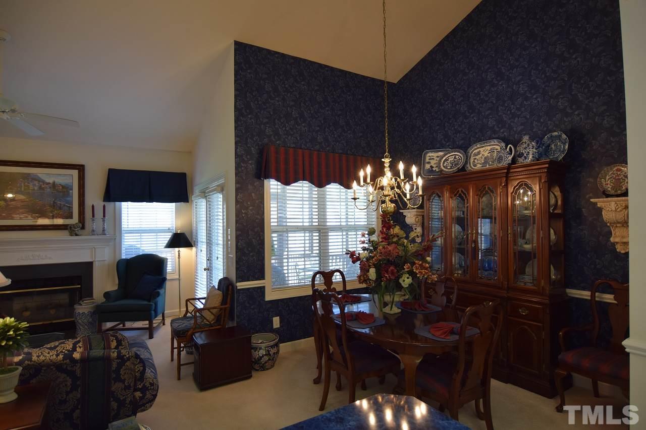 6404 Nowell Pointe Drive Raleigh, NC 27607 - Photo 9 of 24 a view of a dining room with furniture window and outside view