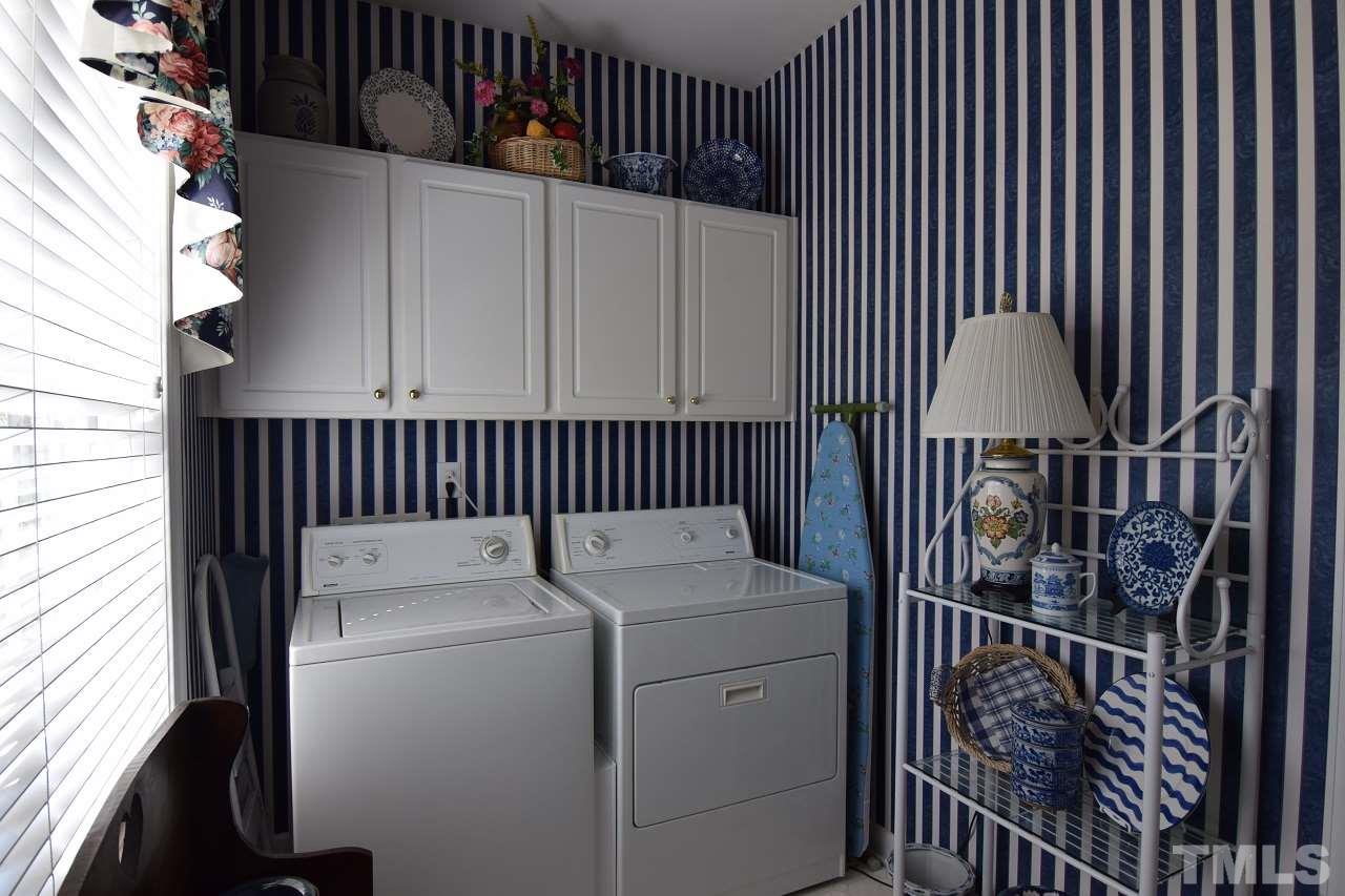 6404 Nowell Pointe Drive Raleigh, NC 27607 - Photo 10 of 24 a utility room with dryer and washer