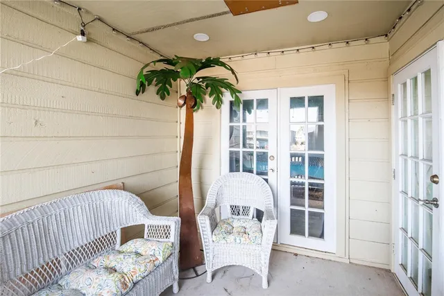 a view of a balcony with furniture