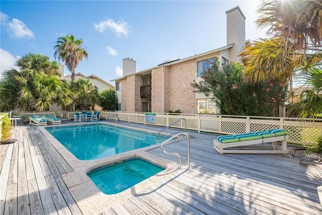 a view of a swimming pool with a patio