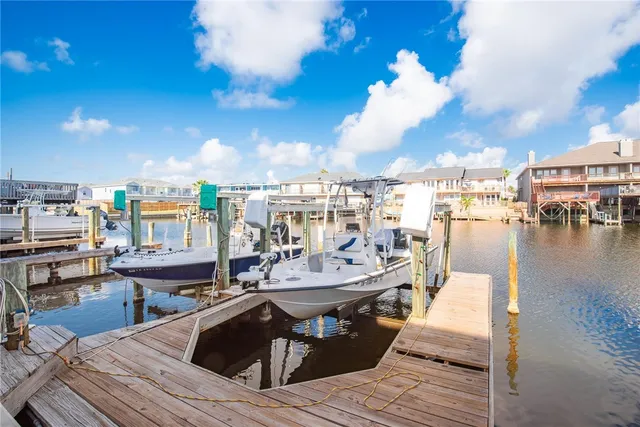 a view of a rooftop deck and patio with swimming pool