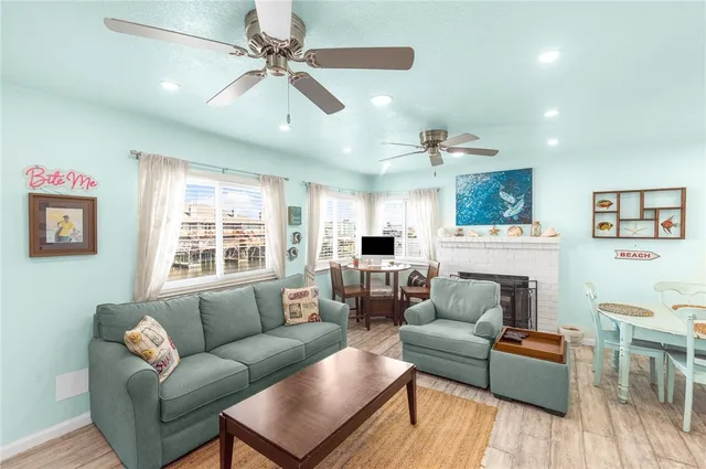 a living room with furniture and a fireplace