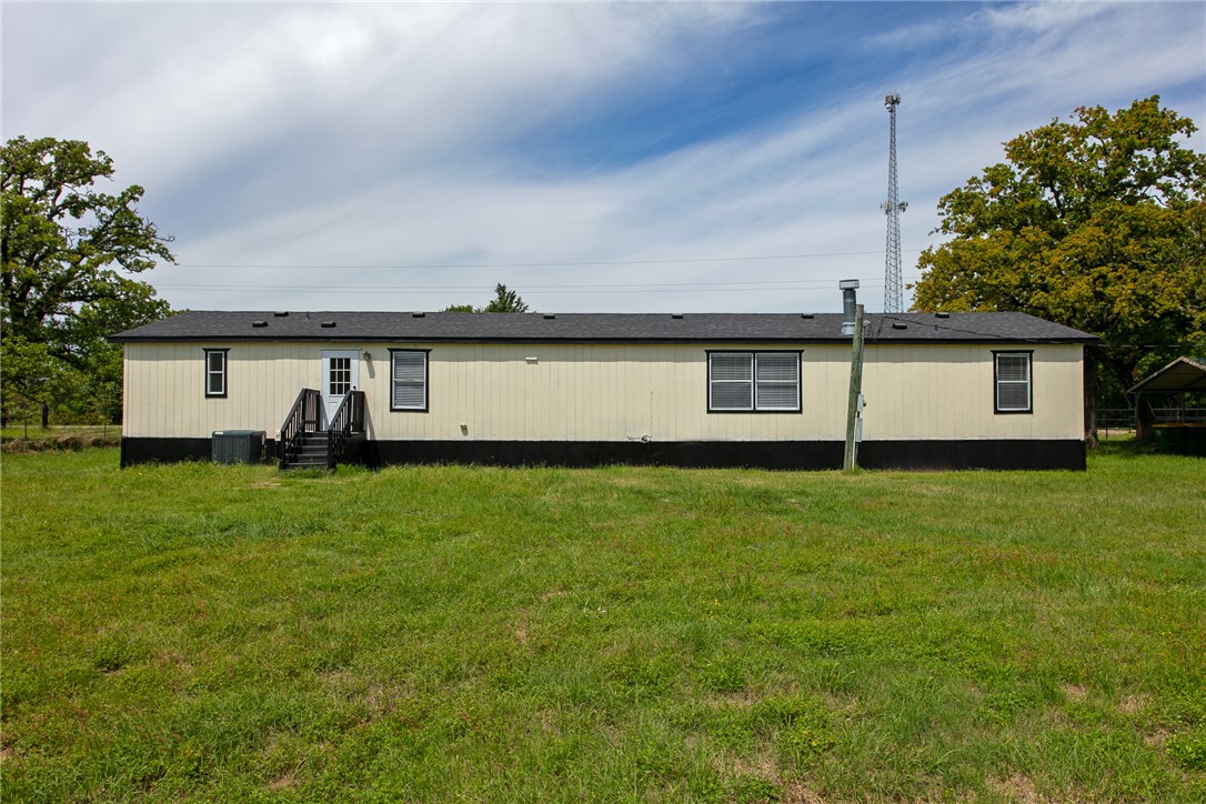 11459 Winstead Lane Calvert, TX 77837 - Photo 25 of 37 a front view of a house with a garden and yard
