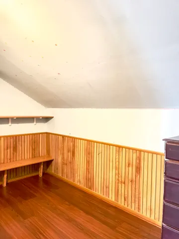 a bathroom with a toilet and a shower curtain