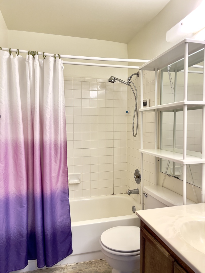 817 74th Street Downers Grove, IL 60516 - Photo 14 of 19 a bathroom with a sink a toilet a tub and shower