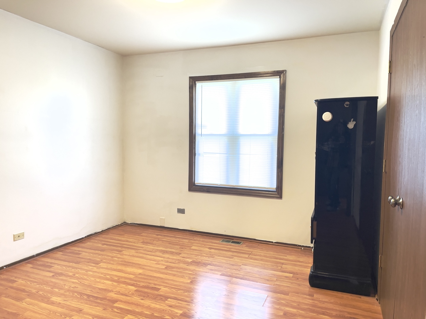 817 74th Street Downers Grove, IL 60516 - Photo 3 of 19 an empty room with wooden floor and windows