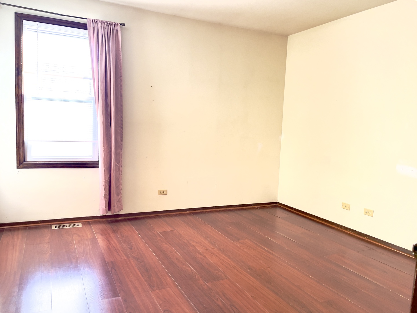 817 74th Street Downers Grove, IL 60516 - Photo 5 of 19 a view of an empty room with wooden floor and a window