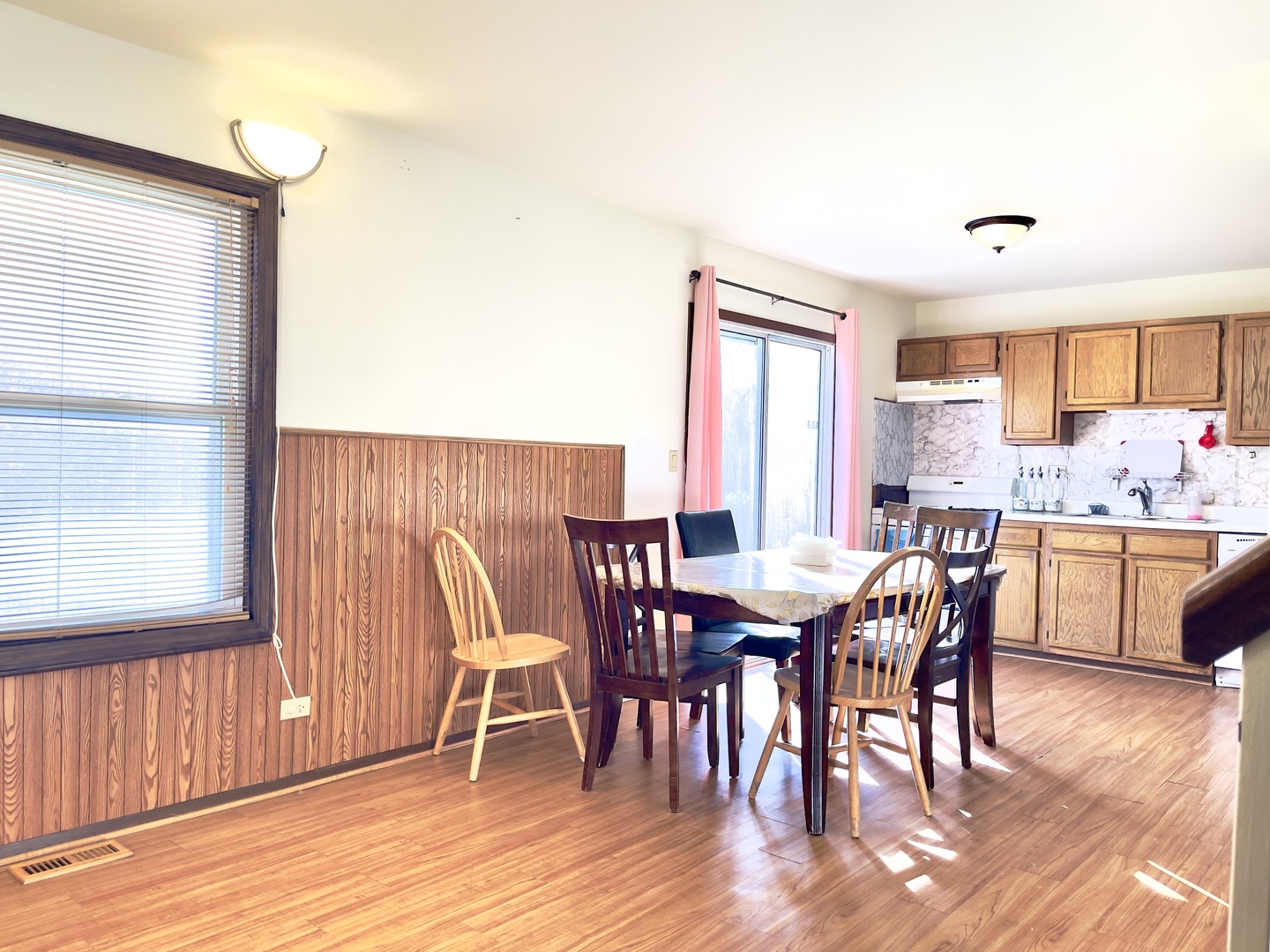 817 74th Street Downers Grove, IL 60516 - Photo 7 of 19 a view of a dining room with furniture and wooden floor