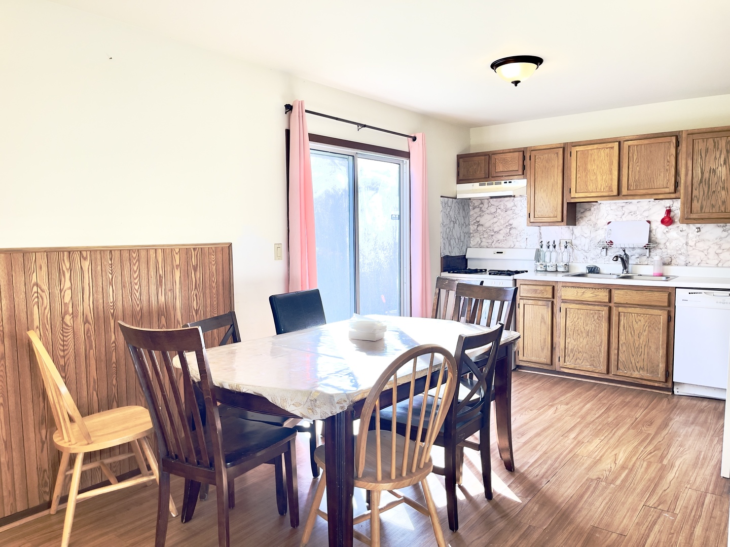 817 74th Street Downers Grove, IL 60516 - Photo 8 of 19 a view of a dining room with furniture and wooden floor