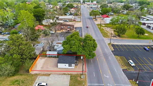 aerial view of multiple houses with an outdoor space