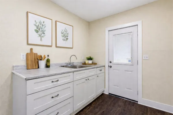 a view of cabinets and wooden floor