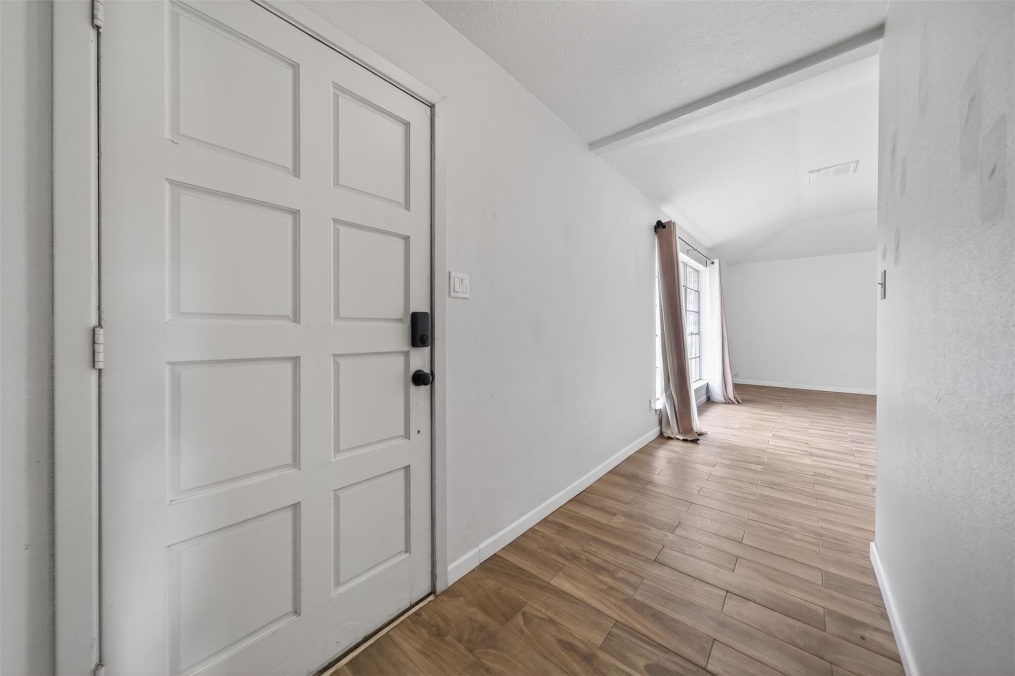17002 Dew Drop Lane Houston, TX 77095 - Photo 12 of 24 a view of an empty room with wooden floor