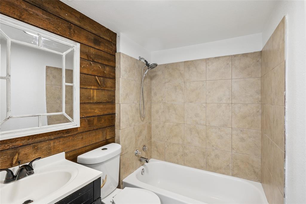 3000 Burchill Road South Fort Worth, TX 76105 - Photo 13 of 26 a bathroom with a sink and a mirror