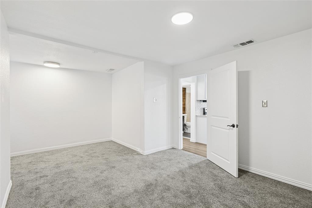 3000 Burchill Road South Fort Worth, TX 76105 - Photo 16 of 26 wooden floor in an empty room