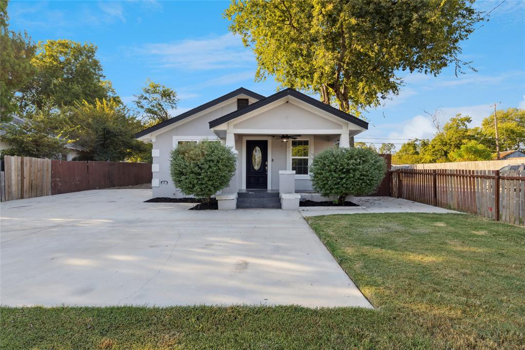 3000 Burchill Road South Fort Worth, TX 76105 - Photo 2 of 26 a front view of a house with garden