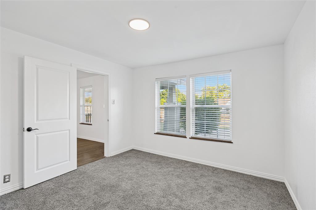 3000 Burchill Road South Fort Worth, TX 76105 - Photo 8 of 26 an empty room with windows