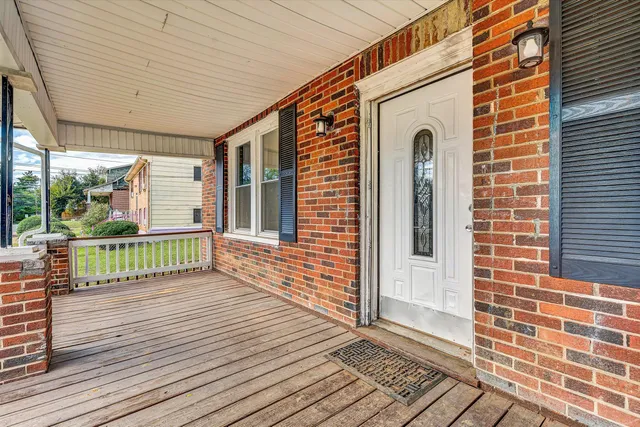 a view of entryway with wooden floor and stairs