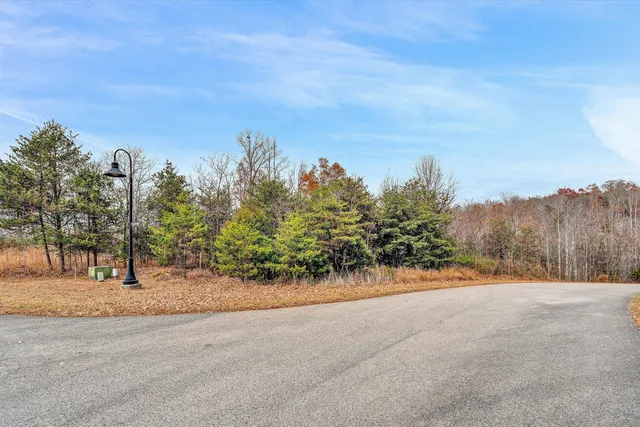 a sign that is sitting in front of flowers