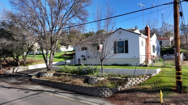 a front view of a house with garden