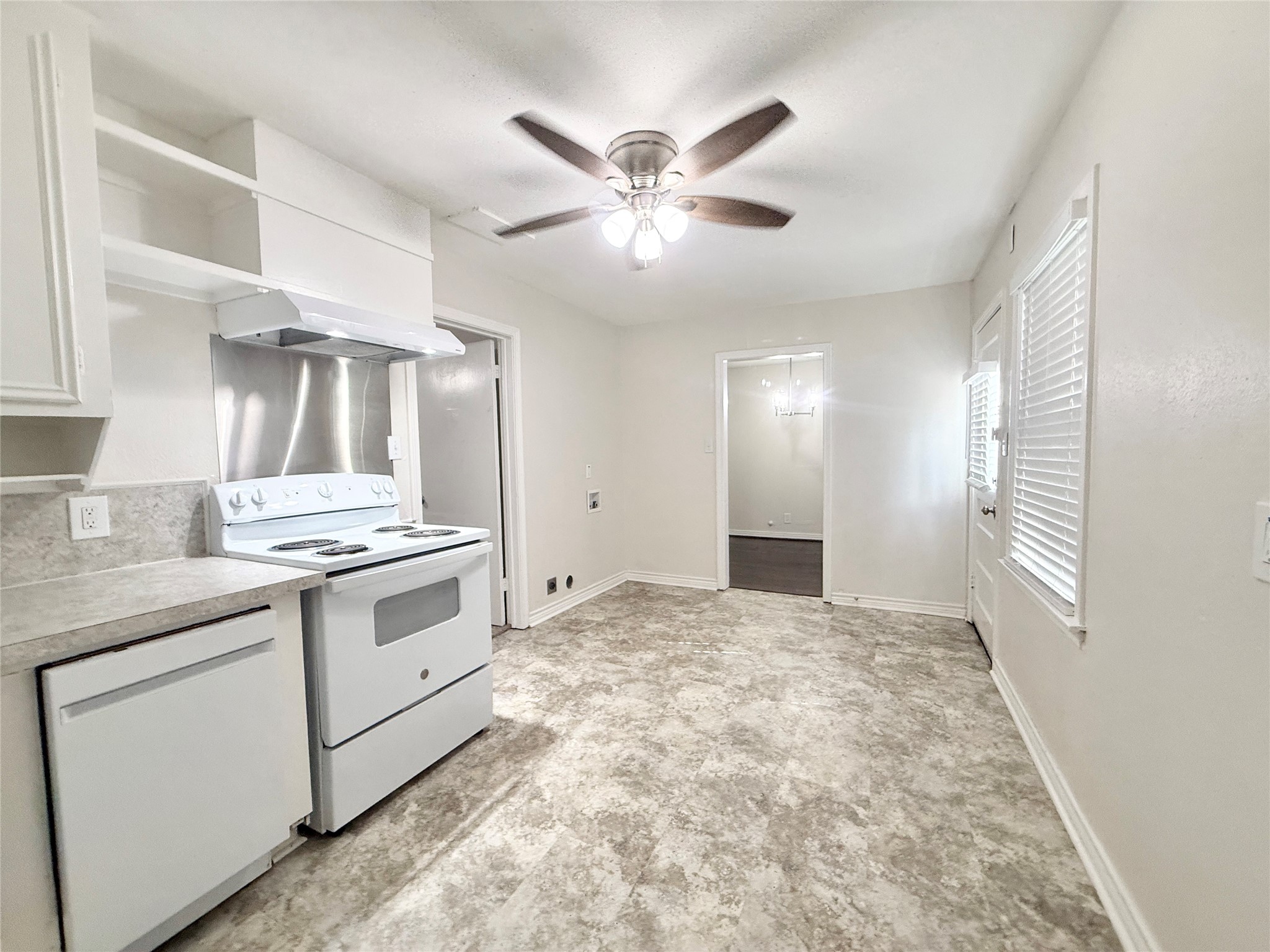 832 South Anderson Street Angleton, TX 77515 - Photo 8 of 19 a kitchen with granite countertop a stove sink and cabinets