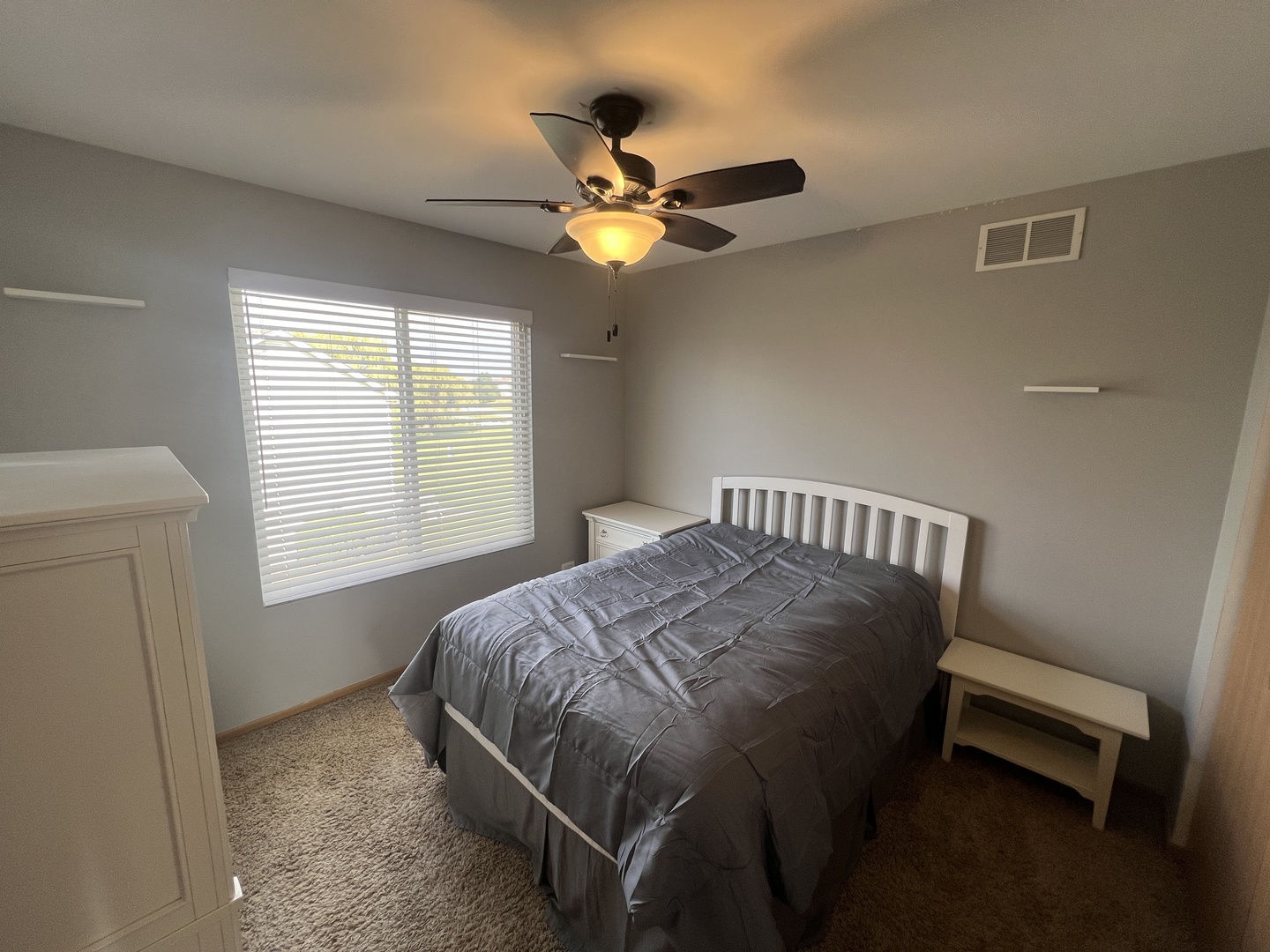 507 Prairie View Drive Minooka, IL 60447 - Photo 15 of 18 a bedroom with a bed and a chandelier