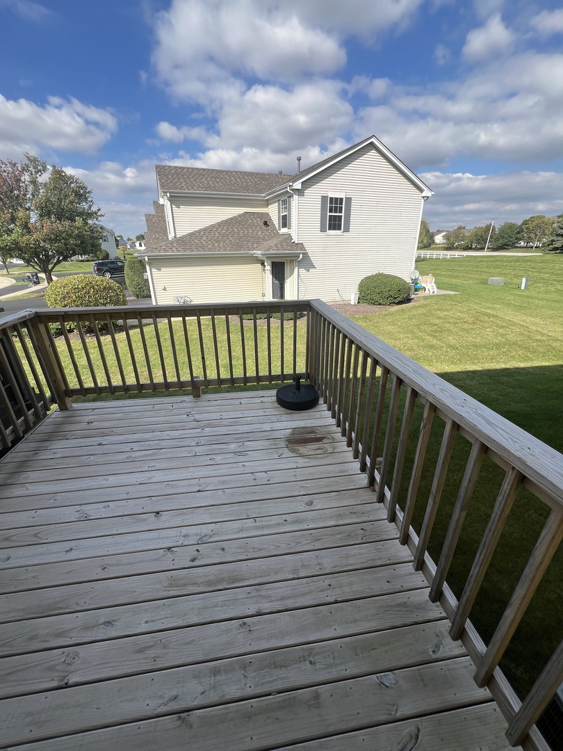 507 Prairie View Drive Minooka, IL 60447 - Photo 16 of 18 a view of a house with a wooden deck