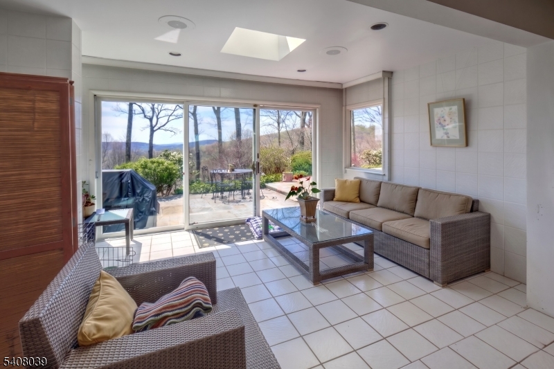 235 Mountainside Road Mendham, NJ 07945 - Photo 14 of 47 a living room with furniture and a large window