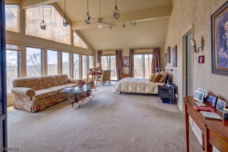 235 Mountainside Road Mendham, NJ 07945 - Photo 18 of 47 a living room with furniture and a large window