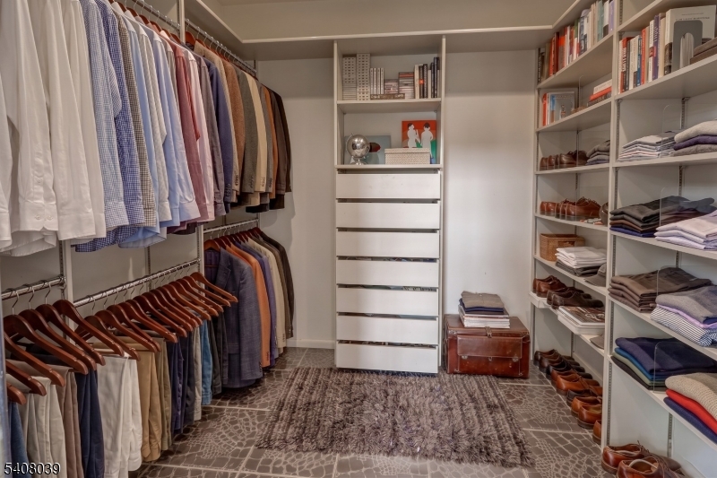 235 Mountainside Road Mendham, NJ 07945 - Photo 20 of 47 a view of walk in closet with clothes and shoes