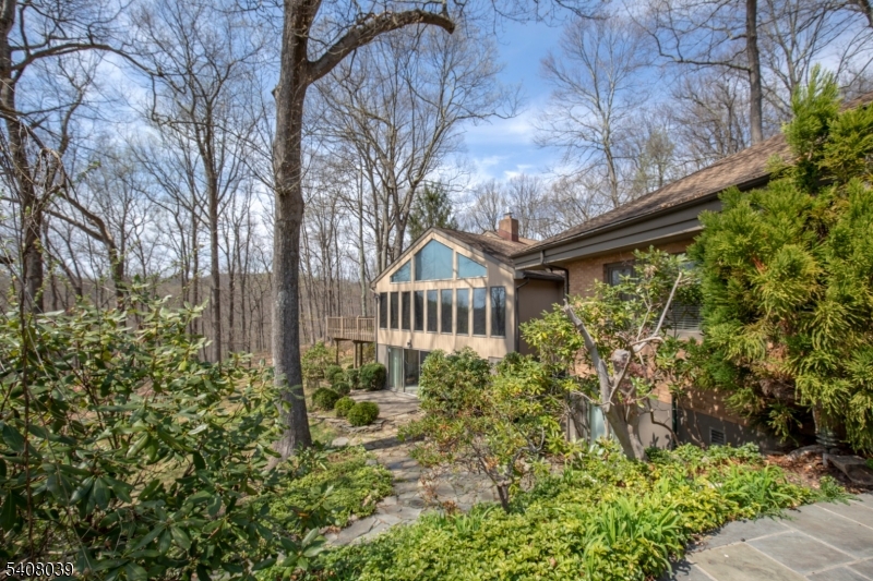 235 Mountainside Road Mendham, NJ 07945 - Photo 36 of 47 a house with lots of trees