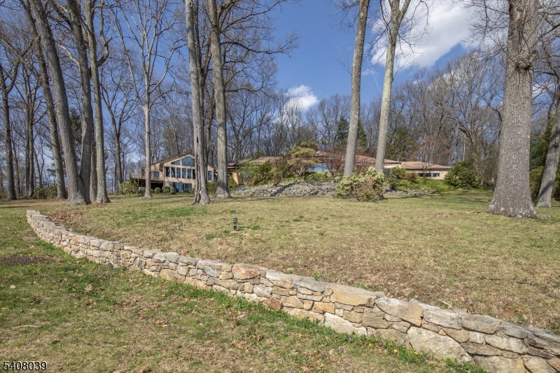 235 Mountainside Road Mendham, NJ 07945 - Photo 37 of 47 a view of a yard with a house