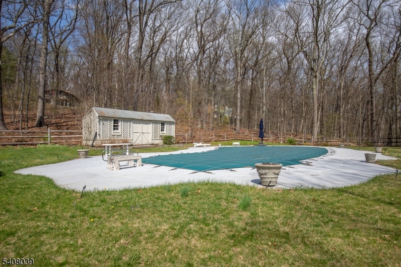 235 Mountainside Road Mendham, NJ 07945 - Photo 39 of 47 a view of a house with backyard and sitting area