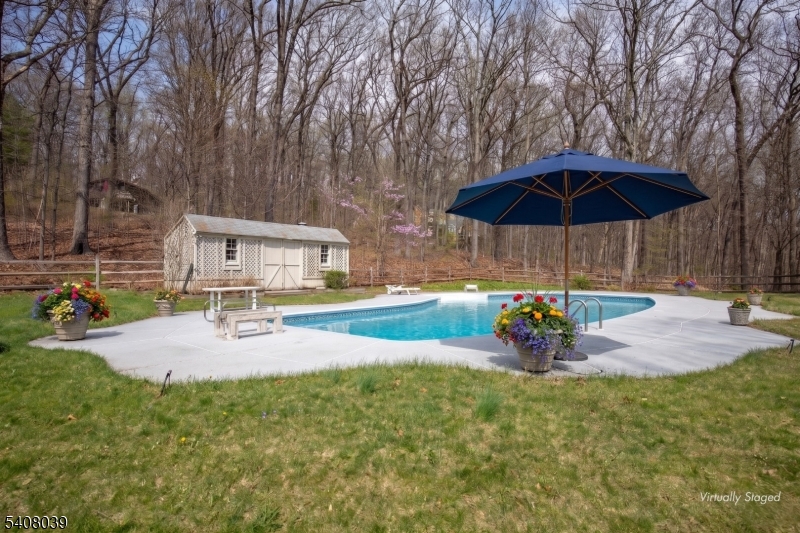 235 Mountainside Road Mendham, NJ 07945 - Photo 40 of 47 a view of a house with backyard and sitting area