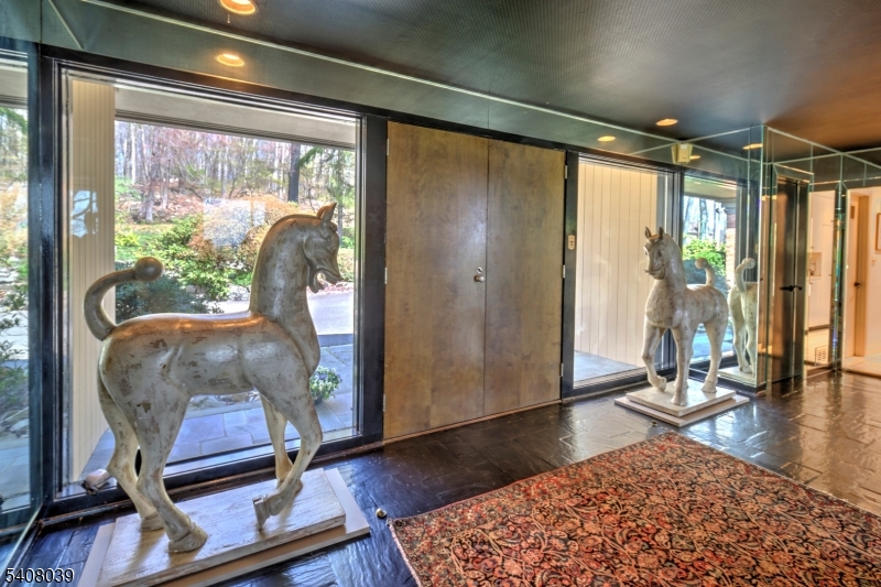 235 Mountainside Road Mendham, NJ 07945 - Photo 8 of 47 a living room with a couch and wooden floor