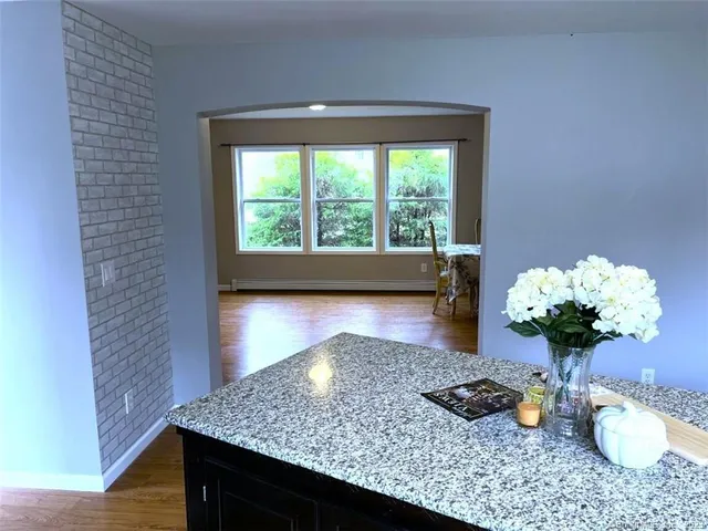 a room with a table potted plant and a couch