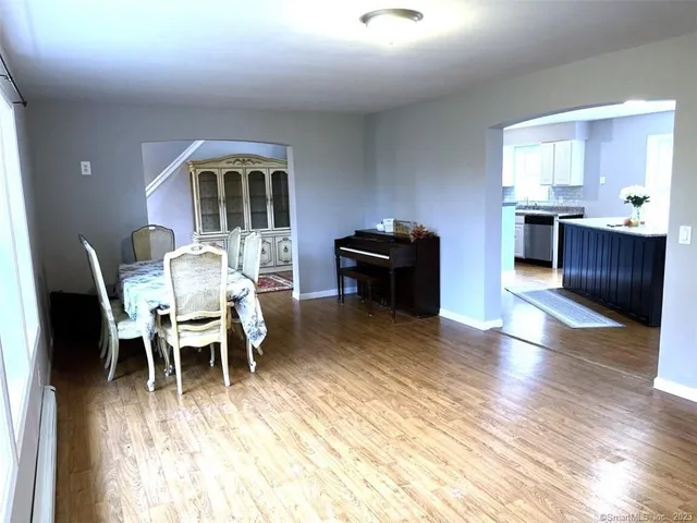 a view of a dining room with furniture window and wooden floor