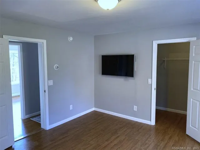 a view of a livingroom with wooden floor