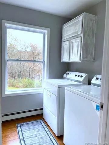 a living room with furniture fireplace and flat screen tv