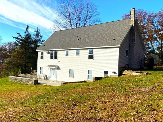 a front view of house with garden