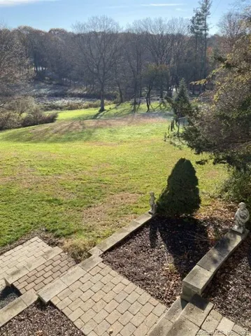 a view of swimming pool with a yard