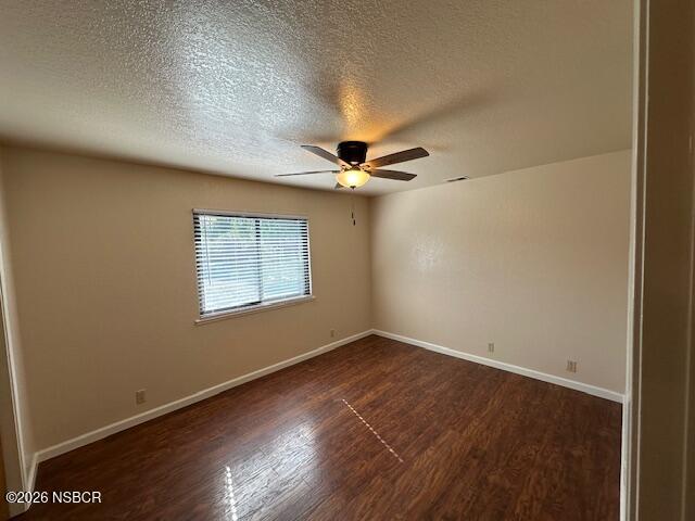 2585 Quail Valley Road Solvang, CA 93463 - Photo 11 of 25 an empty room with wooden floor fan and windows