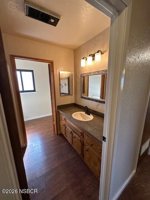 2585 Quail Valley Road Solvang, CA 93463 - Photo 13 of 25 a bathroom with a sink a mirror and a toilet