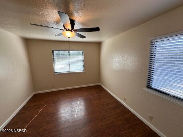 2585 Quail Valley Road Solvang, CA 93463 - Photo 15 of 25 an empty room with wooden floor chandelier fan and windows